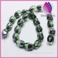 Bead silver-plated glass light green 13x10mm twisted oval